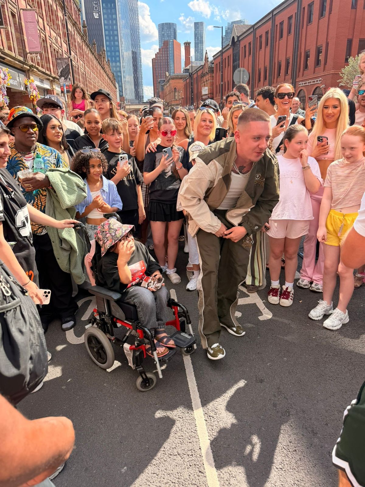 Just hours before the shoot, Aitch had invited fans to join him in Deansgate to appear in the video