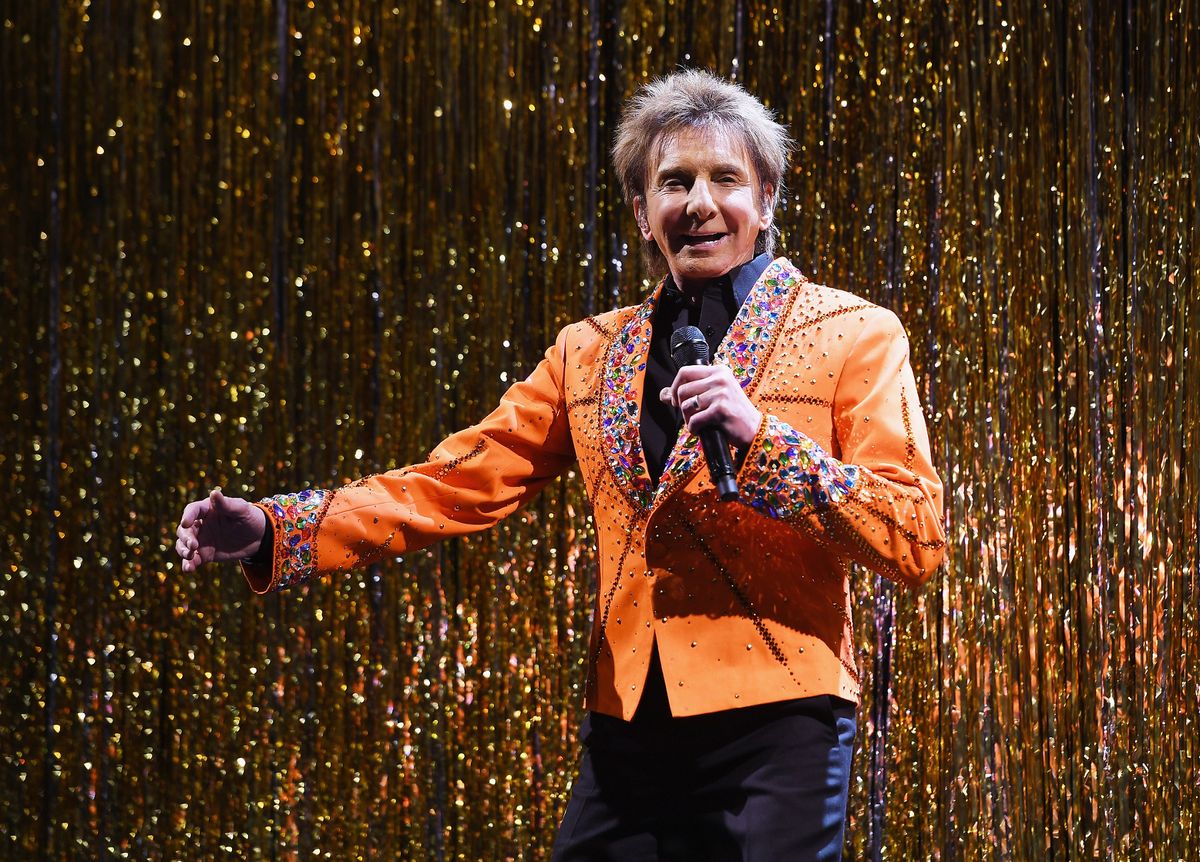 Barry Manilow performs on the runway during the Michael Kors Collection