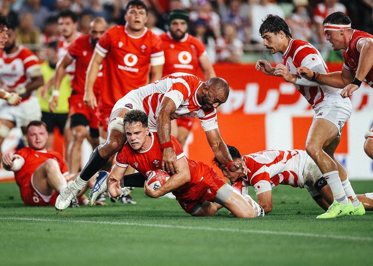 Kieran Hardy of Wales scores a try