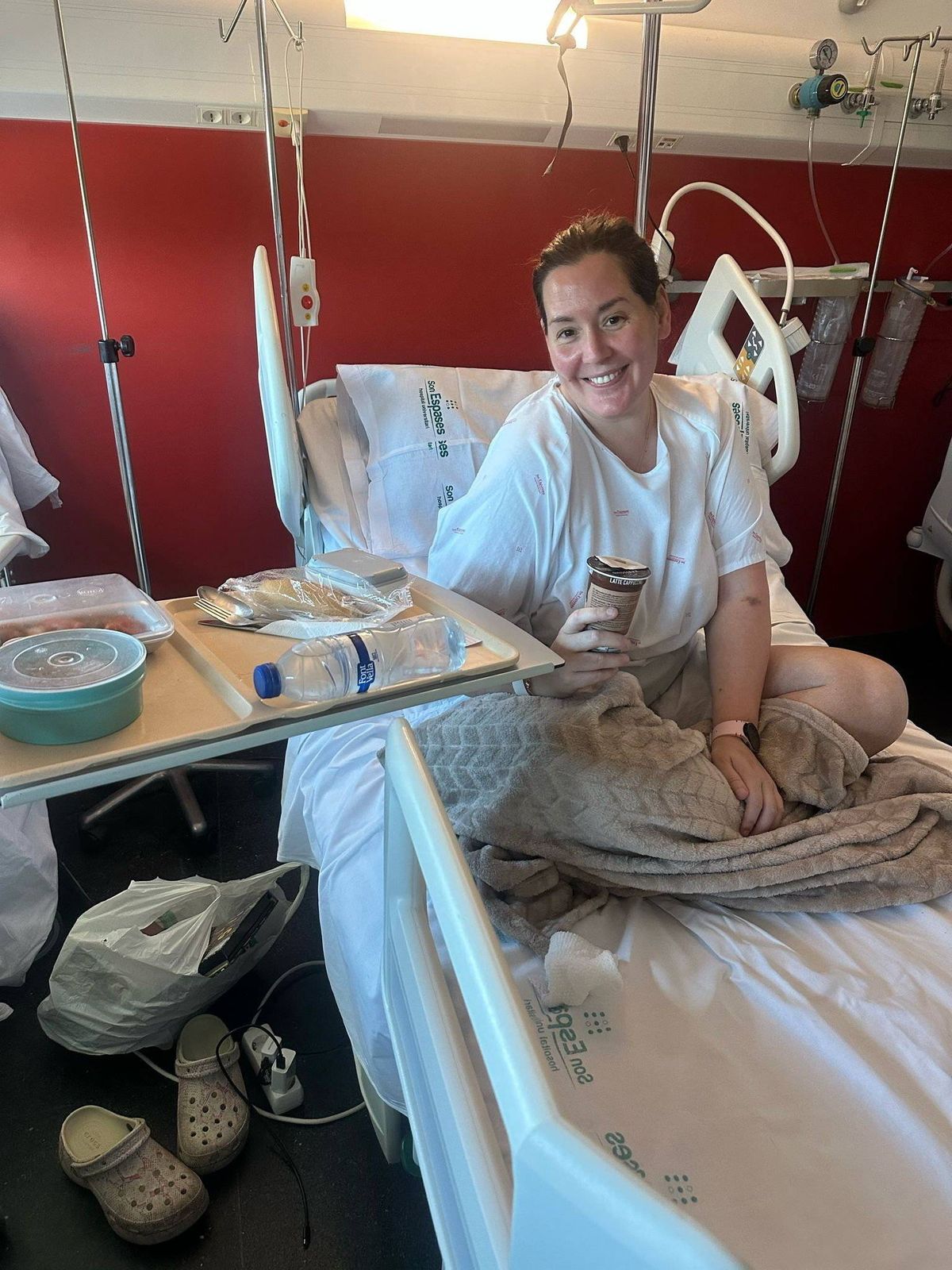 Charlie Wilson, pictured in hospital, lost movement in both legs, her left arm and neck through a rare condition