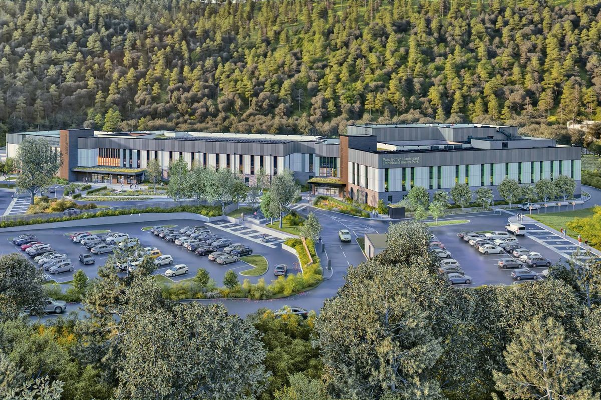 Artist's impression of modern hospital with car park at the front