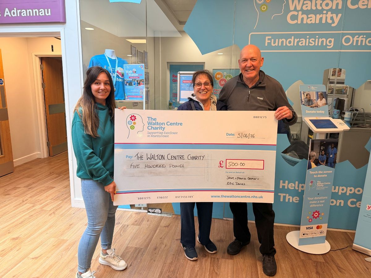 Ellie Davies (left) with mum Marie Garner and stepdad Steve Garner at The Walton Centre