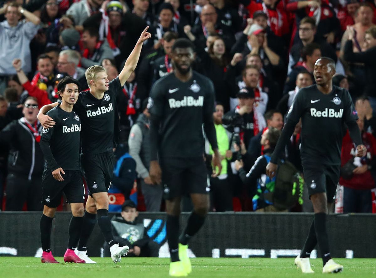 LIVERPOOL, ENGLAND - OCTOBER 02: Takumi Minamino of Red Bull Salzburg celebrates after he scores his sides second goal during the UEFA Champions League group E match between Liverpool FC and RB Salzburg at Anfield on October 02, 2019 in Liverpool, United Kingdom. (Photo by Clive Brunskill/Getty Images)