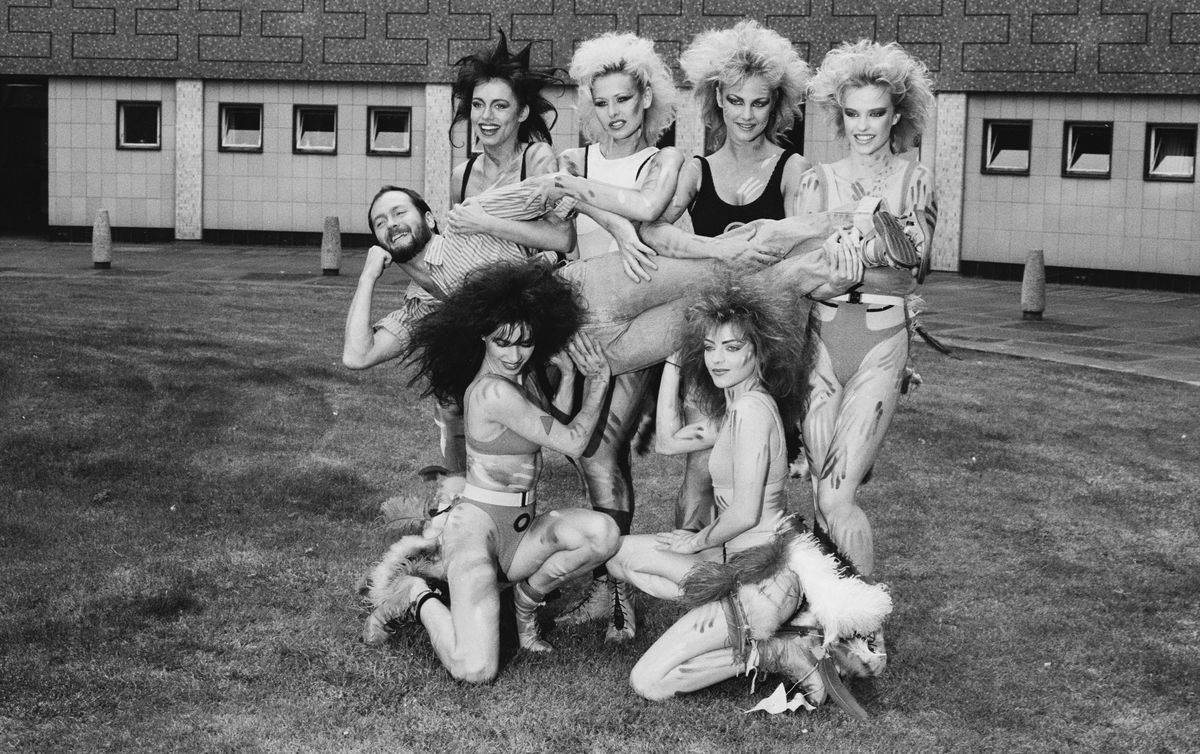 Kenny Everett posing with Hot Gossip