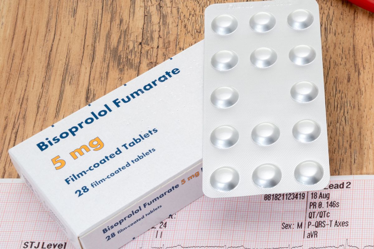 A heart trace ECG with a generic box of Bisoprolol beta blocker pills and a stethoscope