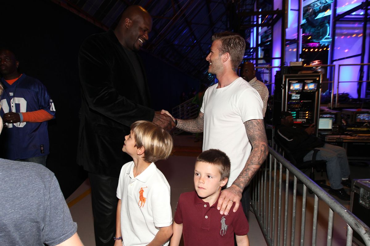 Athlete Shaquille O'Neal (top L), pro soccer player David Beckham (top R) and sons (bottom L-R) Romeo Beckham and Cruz Beckham attend the 2012 Cartoon Network Hall of Game Awards at Barker Hangar on February 18, 2012 in Santa Monica, California.