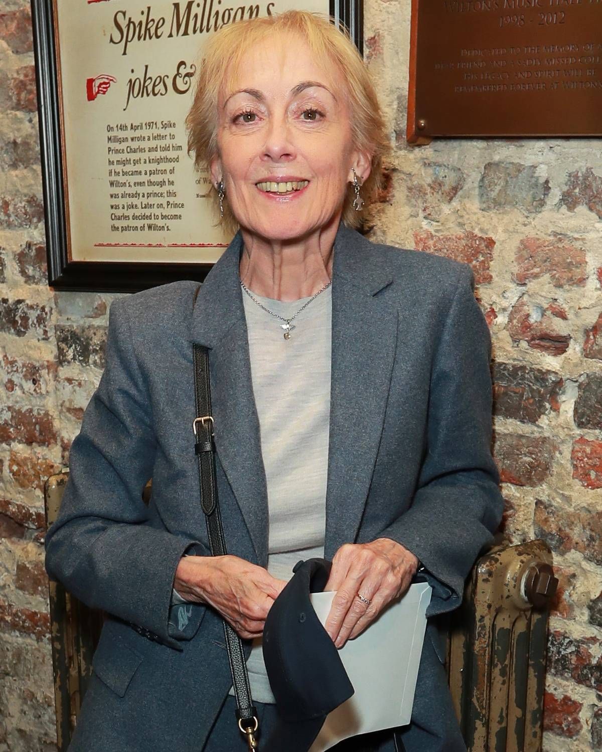 Light haired woman in blue blazer