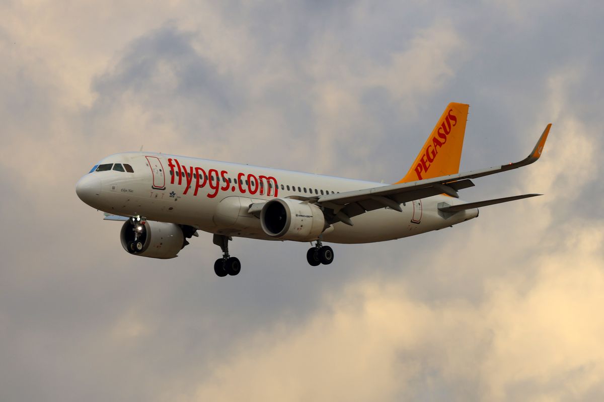 A Pegasus Airlines plane flying in the sky 