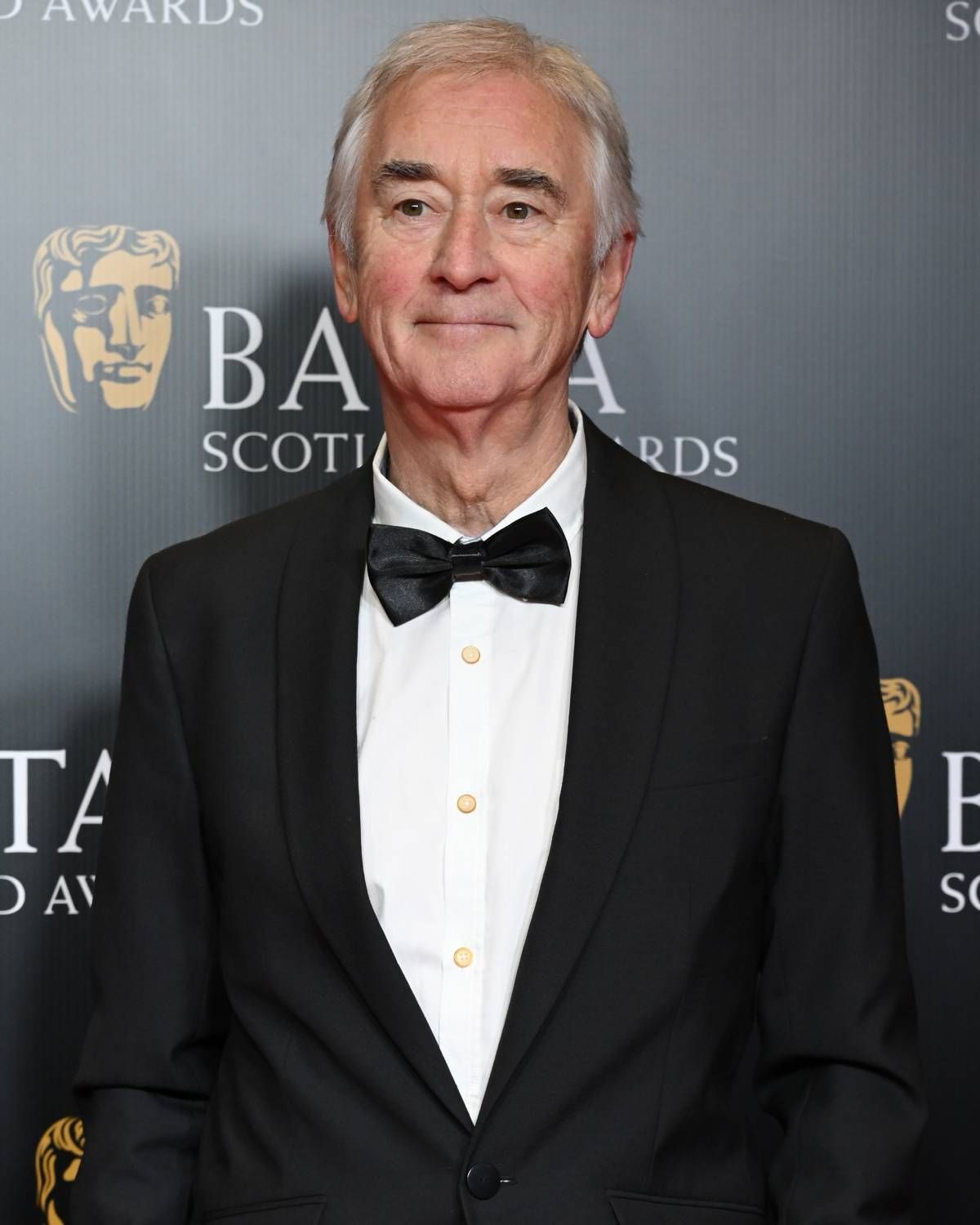 Grey haired man in tuxedo
