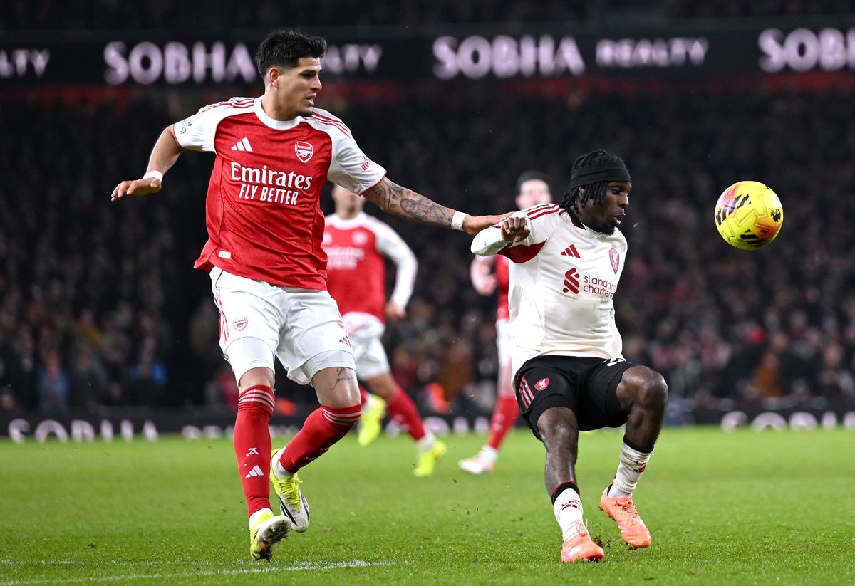 Jeremie Frimpong of Liverpool battles for possession with Piero Hincapie of Arsenal during the Premier League match between Arsenal and Liverpool at Emirates Stadium on January 08, 2026 in London, England