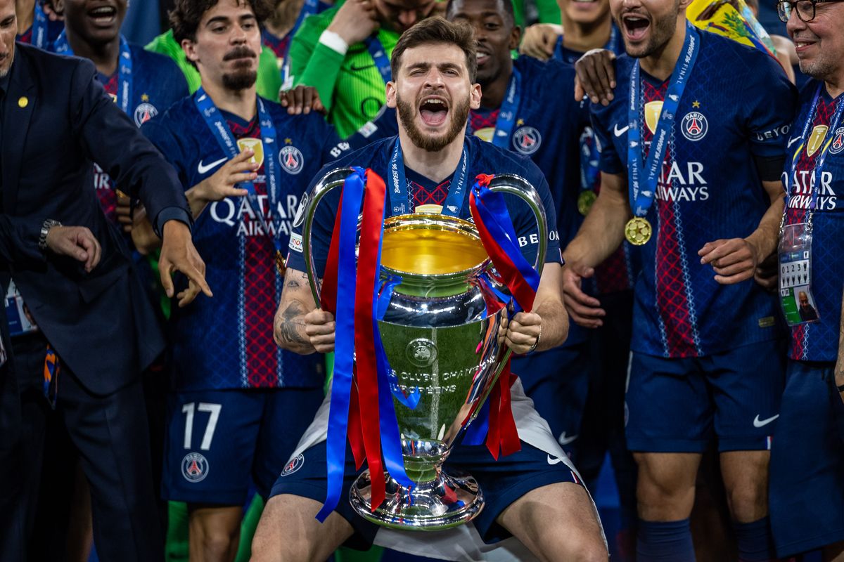 Khvicha Kvaratskhelia of Paris Saint-Germain lifts the UEFA Champions League trophy after his team's victory in the UEFA Champions League Final 2026 match between Paris Saint-Germain and Arsenal FC at Puskas Arena on May 30, 2026 in Budapest, Hungary