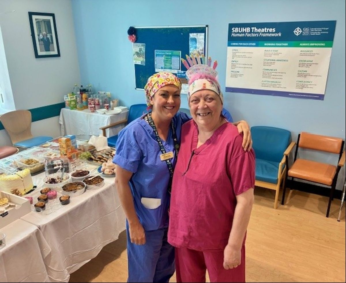 Anita and Louise Evans, Speciality Manager, Morriston Hospital Theatres at a birthday celebration held in the department.
