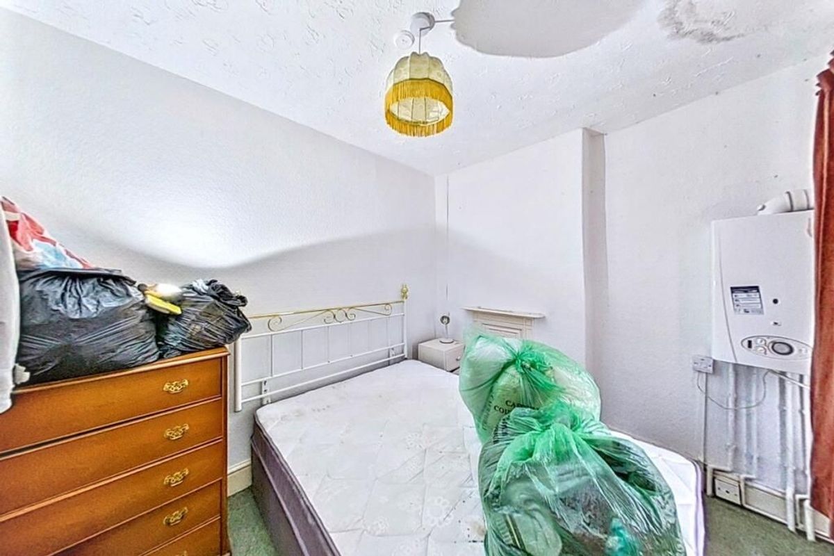The house has three-bedrooms, one being used as a walk-in wardrobe, and the bathroom is on the ground floor at Last house on the streets of village of Troedrhiwfuwch going to auction with guide price of £35k plus with Paul Fosh Auctions