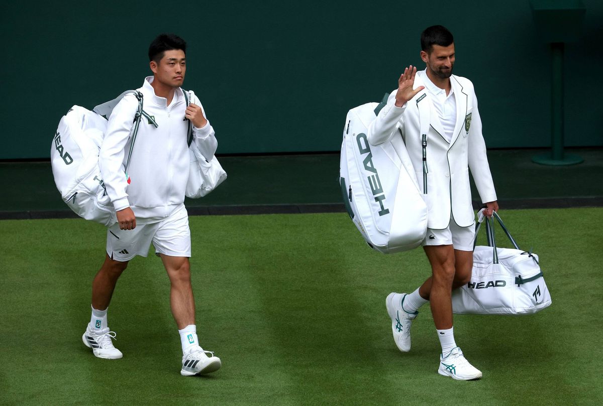 Novak Djokovic and opponent Wu Yuibing