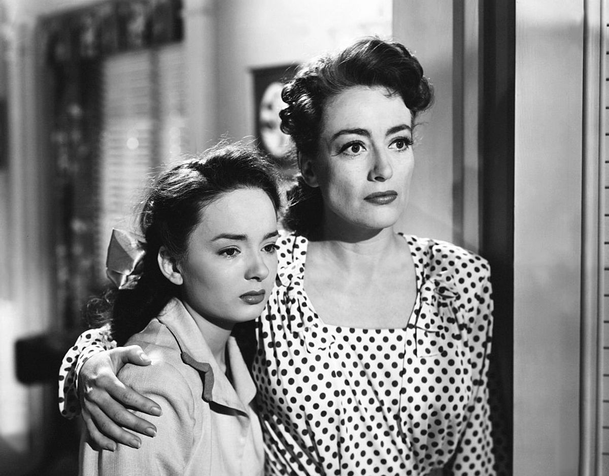 American actresses Ann Blyth and Joan Crawford on the set of Mildred Pierce