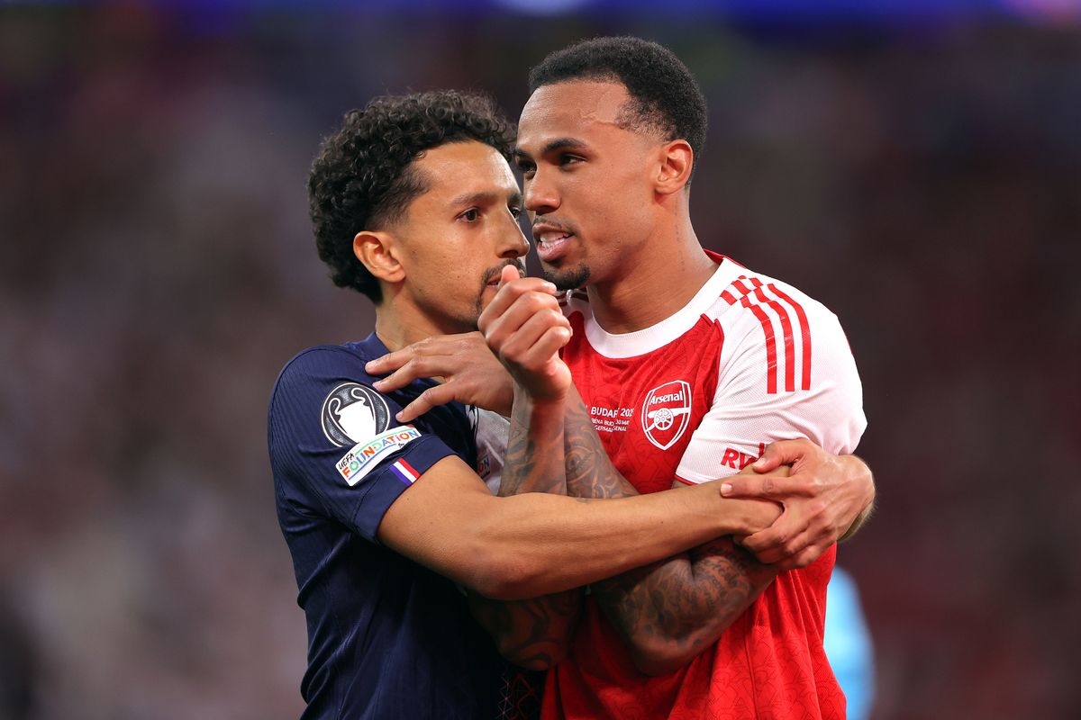 Marquinhos of Paris Saint-Germain consoles Gabriel of Arsenal