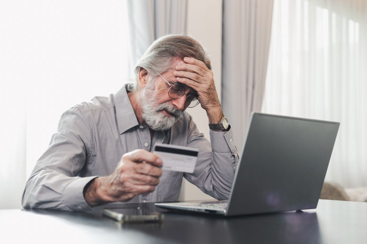 An older man looking at his finances