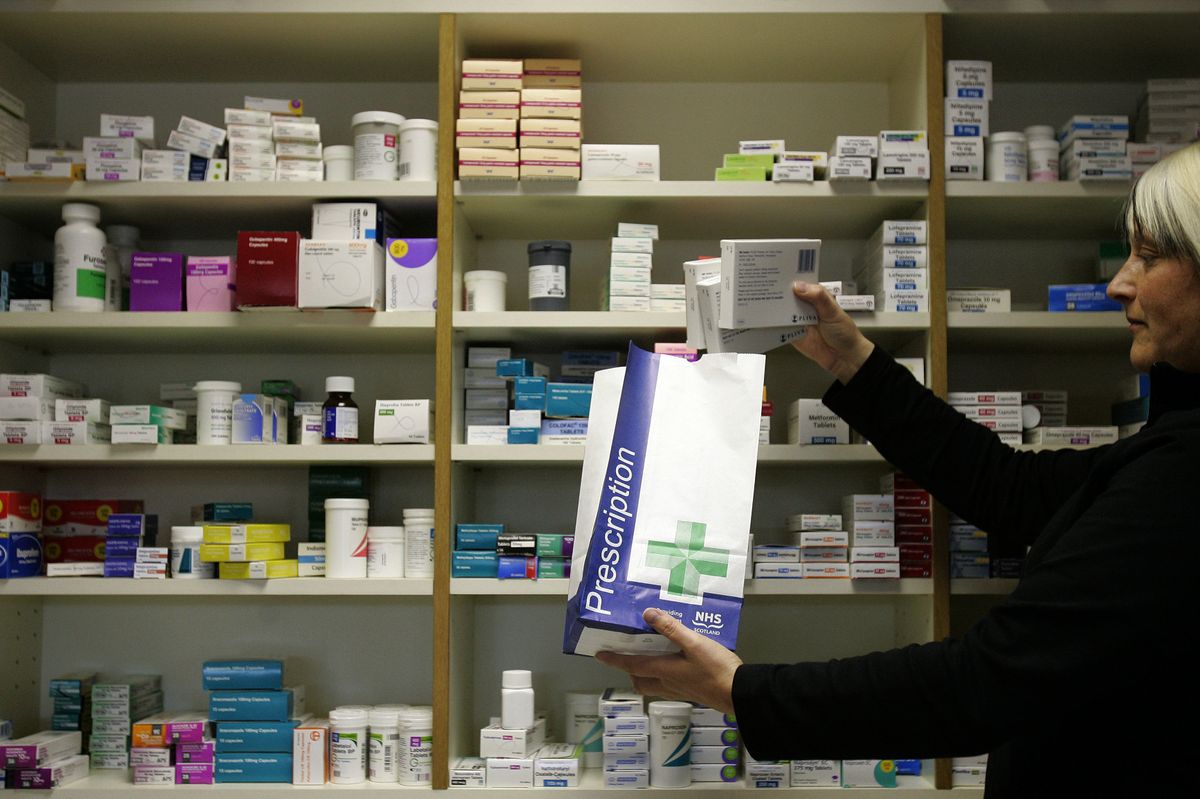 a prescription being collected from the Craigton Pharmacy in Glasgow