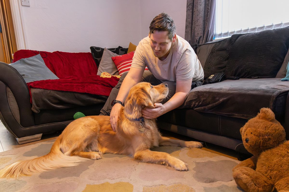 Oliver Perry with guide dog Walter