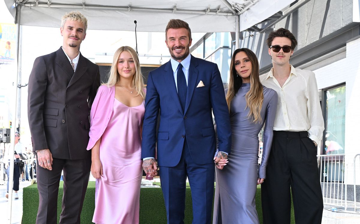 Romeo Beckham, Harper Beckham, English former footballer David Beckham, Victoria Beckham and Cruz Beckham pose next to his newly unveiled Hollywood Walk of Fame star