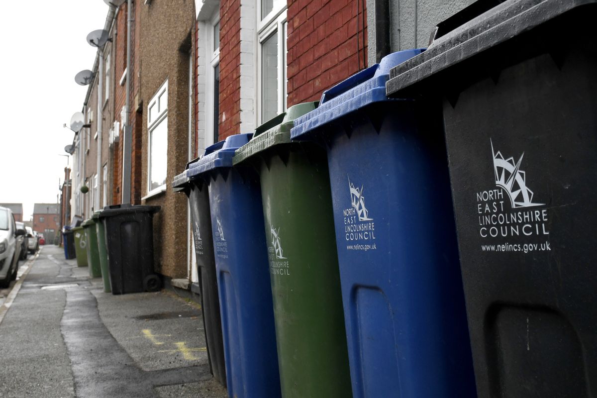North East Lincolnshire Council bins on a street in East Marsh; the black or grey recycling bins have been disrupted lately due to a staffing issue, but all other collections are not affected