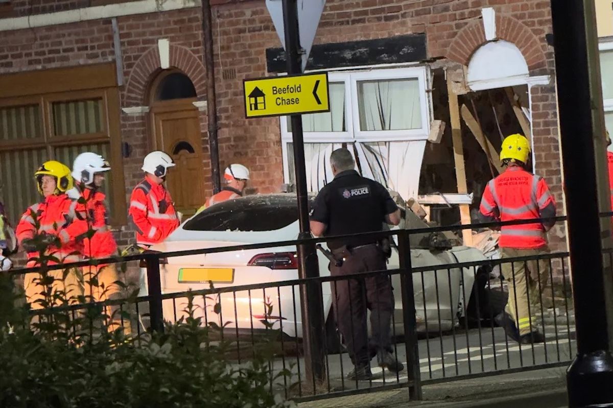 Crews descend after a Tesla ploughs into a house in Atherton