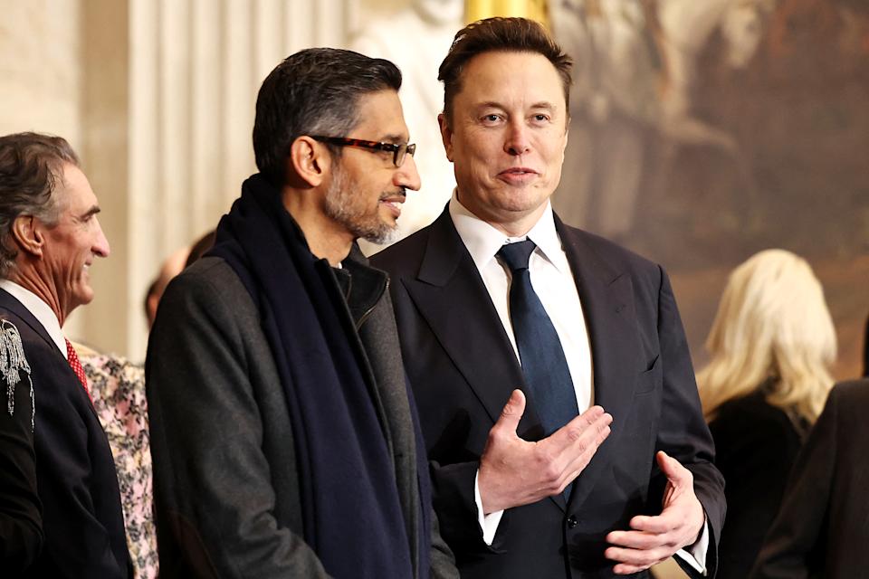 CEO of Google Sundar Pichai (L) and Tesla, SpaceX and X CEO Elon Musk speak ahead of the inauguration of U.S. President-elect Donald Trump in the Rotunda of the U.S. Capitol on January 20, 2025 in Washington, DC. Donald Trump takes office for his second term as the 47th president of the United States. (Photo by Chip Somodevilla / POOL / AFP via Getty Images)