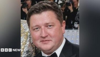 Daniel Vettrino looking straight at the camera. He has short, dark hair. He is wearing a black suit over a white shirt with a bow tie. Only his head and neck are visible.