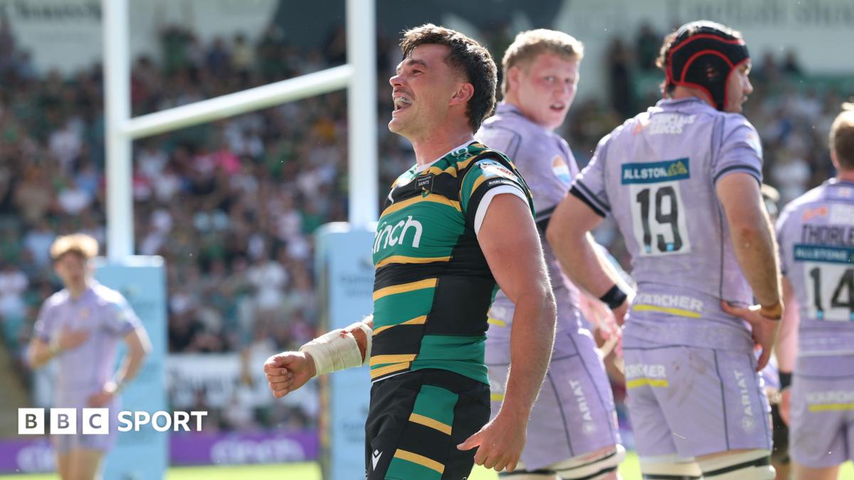 George Furbank, wearing his green, black and yellow striped Northampton Saints kit, celebrates his try against Gloucester in May