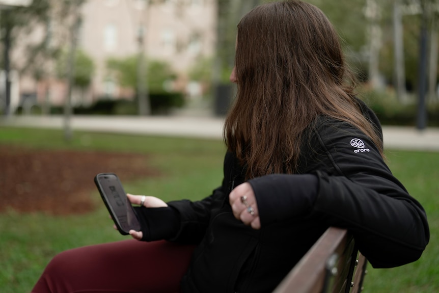Woman sitting on a park bench