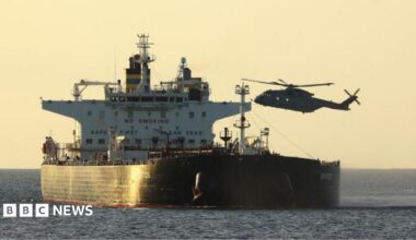 A helicopter boarding a vessel in the English Channel