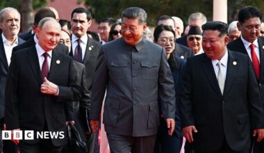 (L-R) Russia's President Vladimir Putin walks with China's President Xi Jinping and North Korea's leader Kim Jong Un