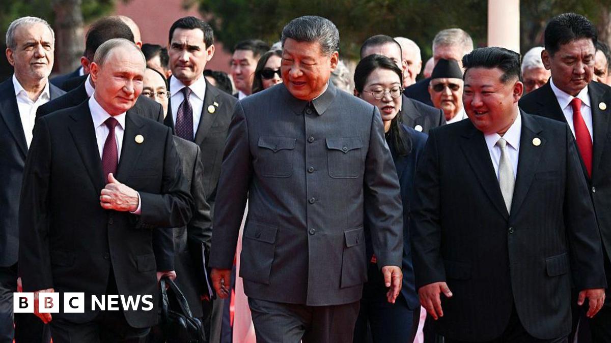 (L-R) Russia's President Vladimir Putin walks with China's President Xi Jinping and North Korea's leader Kim Jong Un