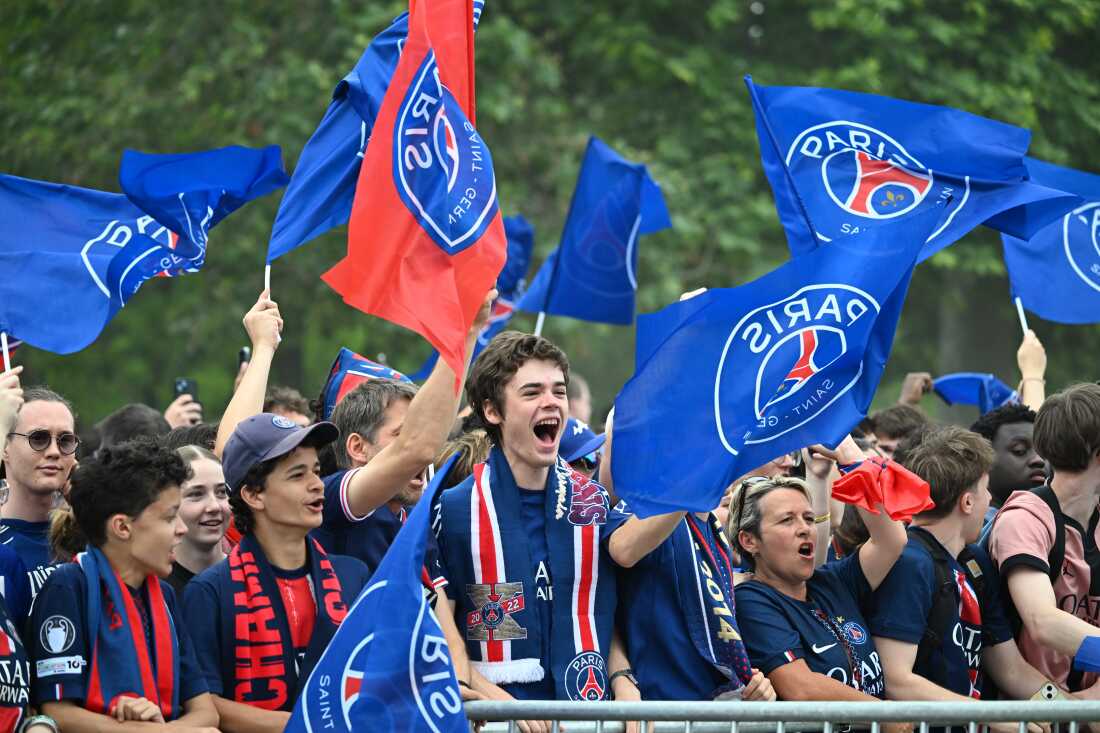 PSG fans celebrate the day after winning the Champions League title, at the Eiffel Tower, in Paris, Sunday, May 31, 2026.