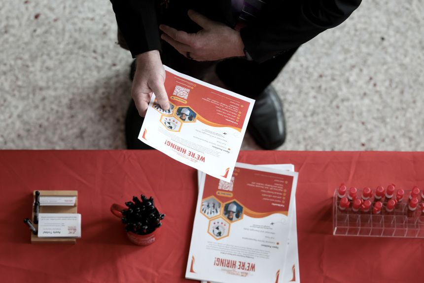 A job seeker visits a recruiting booth during the Mega JobNewsUSA South Florida Job Fair held in the Amerant Bank Arena on April 30, 2026 in Sunrise, Florida.