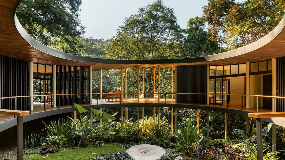 A curved home on stilts in a lush rainforest (Credit: Alvaro Fonseca) A curved home on stilts in a lush rainforest (Credit: Alvaro Fonseca)