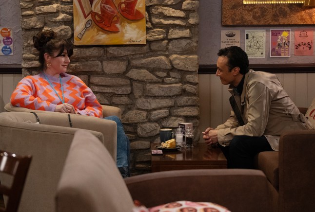 Kerry Wyatt and Jai Sharma sat across from each other in the café in Emmerdale