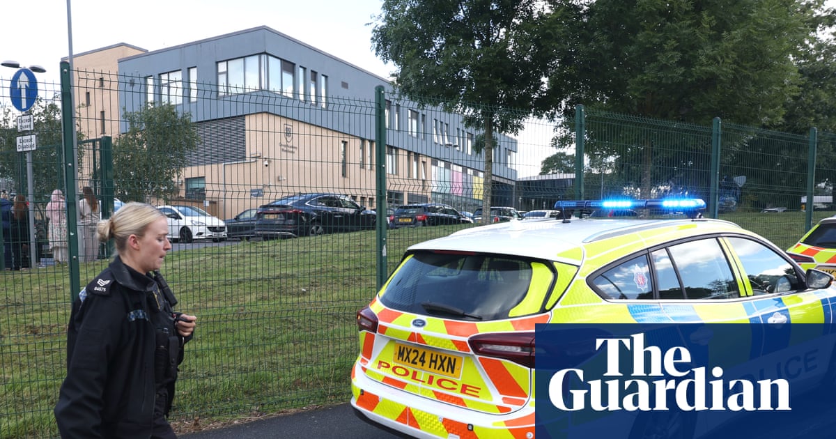 Girl, 14, charged in connection with triple stabbing at school in Manchester | UK news