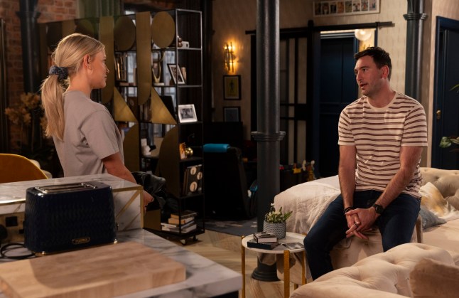 Kit Green and Bethany Platt talking in their flat in Coronation Street