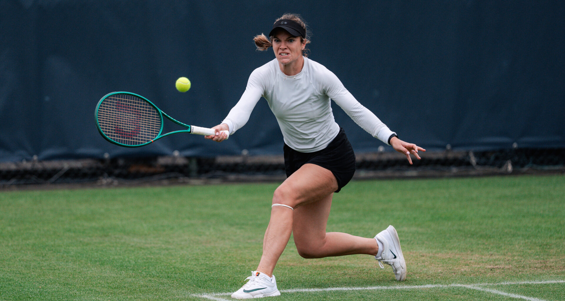 McNally battles past Tjen in 3:10 feast of grass-court style