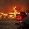 A resident of Altadena, Calif., tried to protect property during wildfires in January 2025.