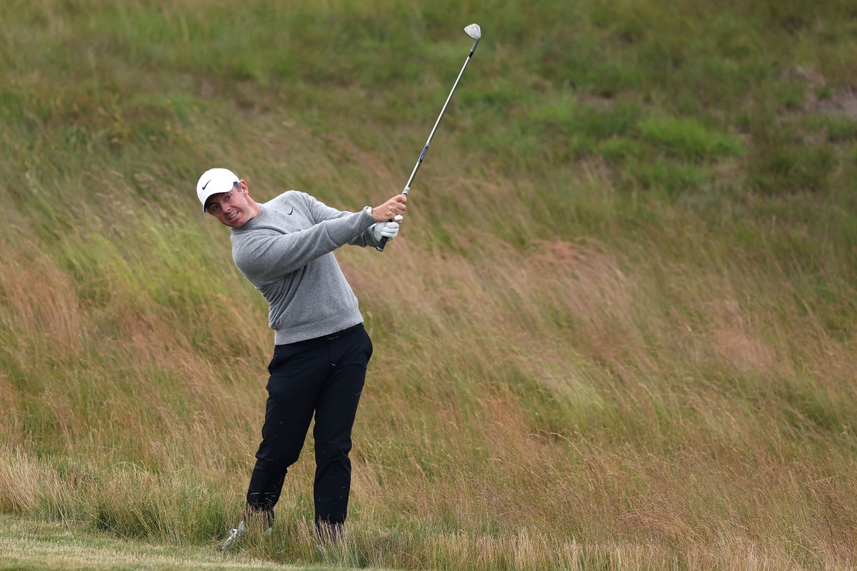 Rory McIlroy plays a ball