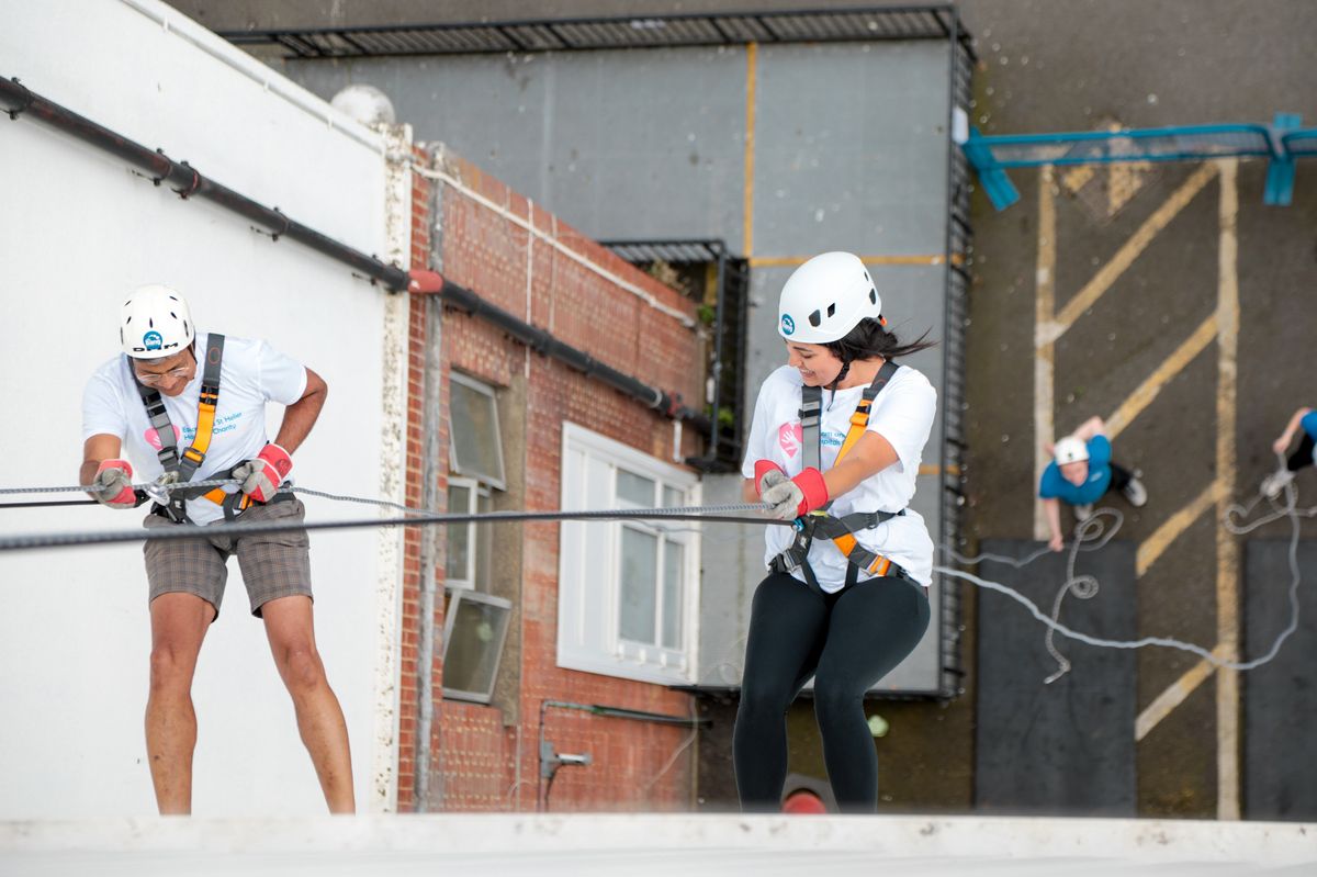 Fred and Sarah abseiling