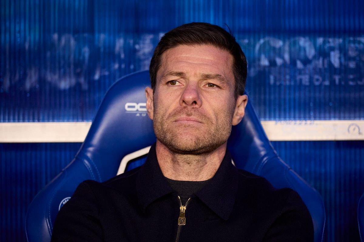 Xabi Alonso sitting on the bench