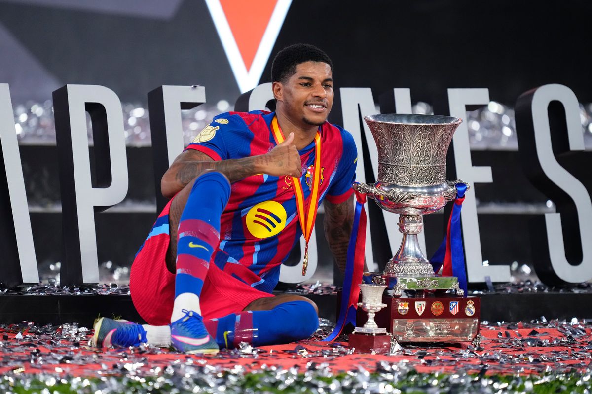 Marcus Rashford left winger of Barcelona and England celebrates with the trophy after winning the Spanish Super Cup final match between FC Barcelona and Real Madrid at King Abdullah Sports City Hall Stadium on January 11, 2026 in Jeddah, Saudi Arabia.