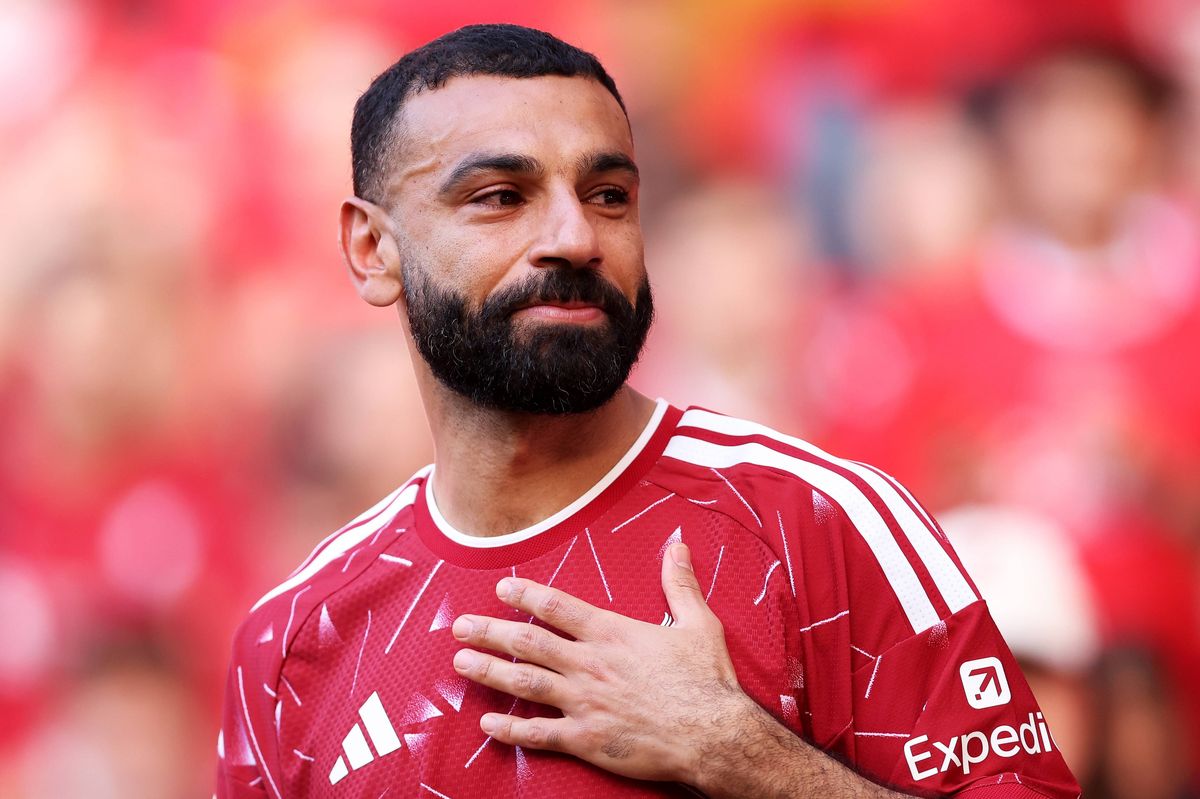 Mohamed Salah of Liverpool touches his chest