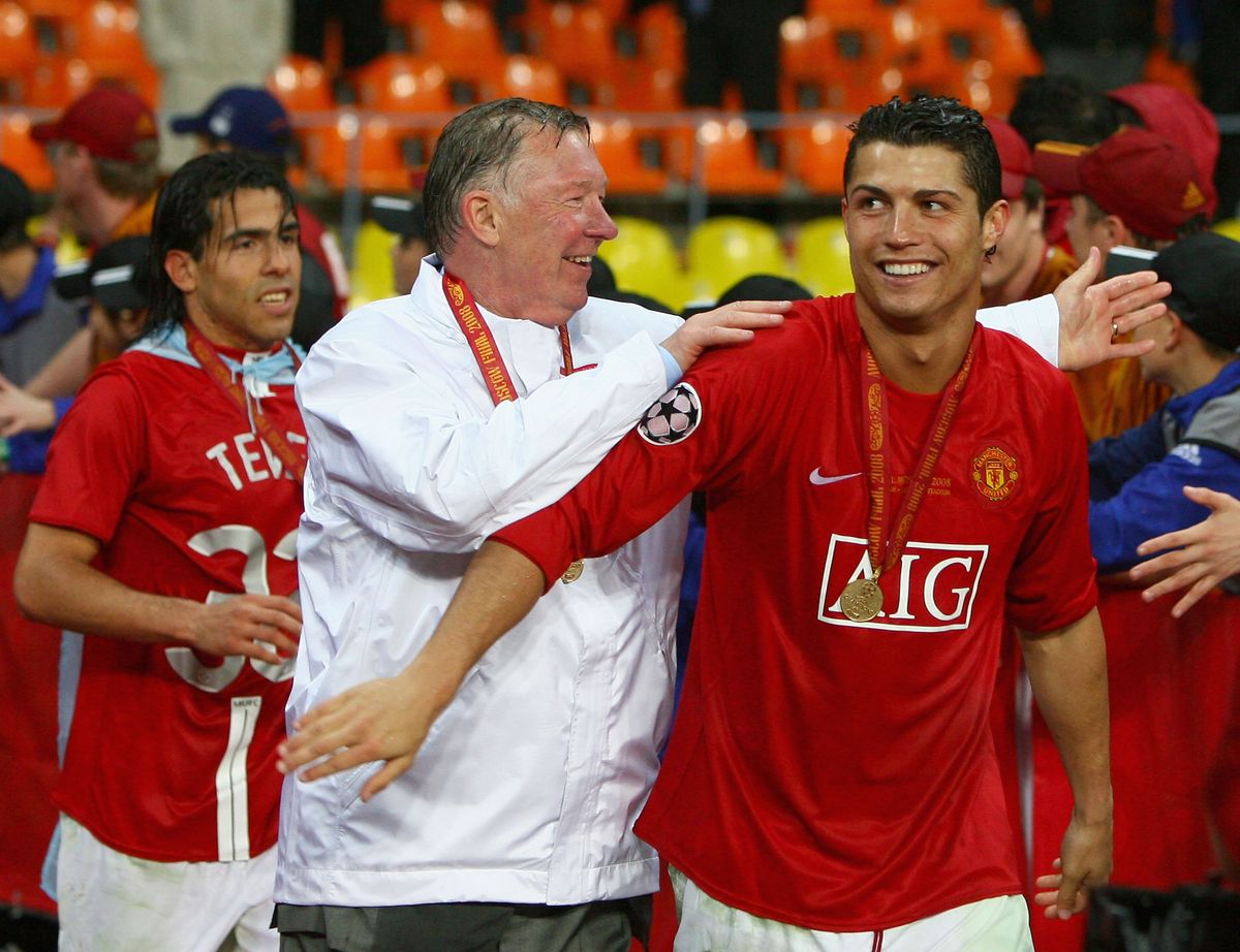 Manchester United manager Sir Alex Ferguson (C) smiles with Cristiano Ronaldo of Manchester United after the UEFA Champions League Final match between Manchester United and Chelsea at the Luzhniki Stadium on May 21, 2008 in Moscow, Russia.