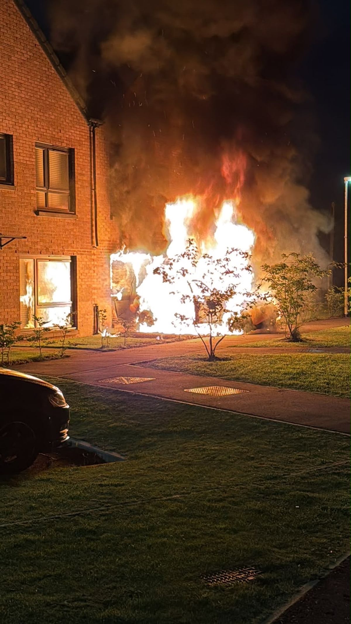 A neighbour explained how a petrol bomb was thrown at the vehicle.