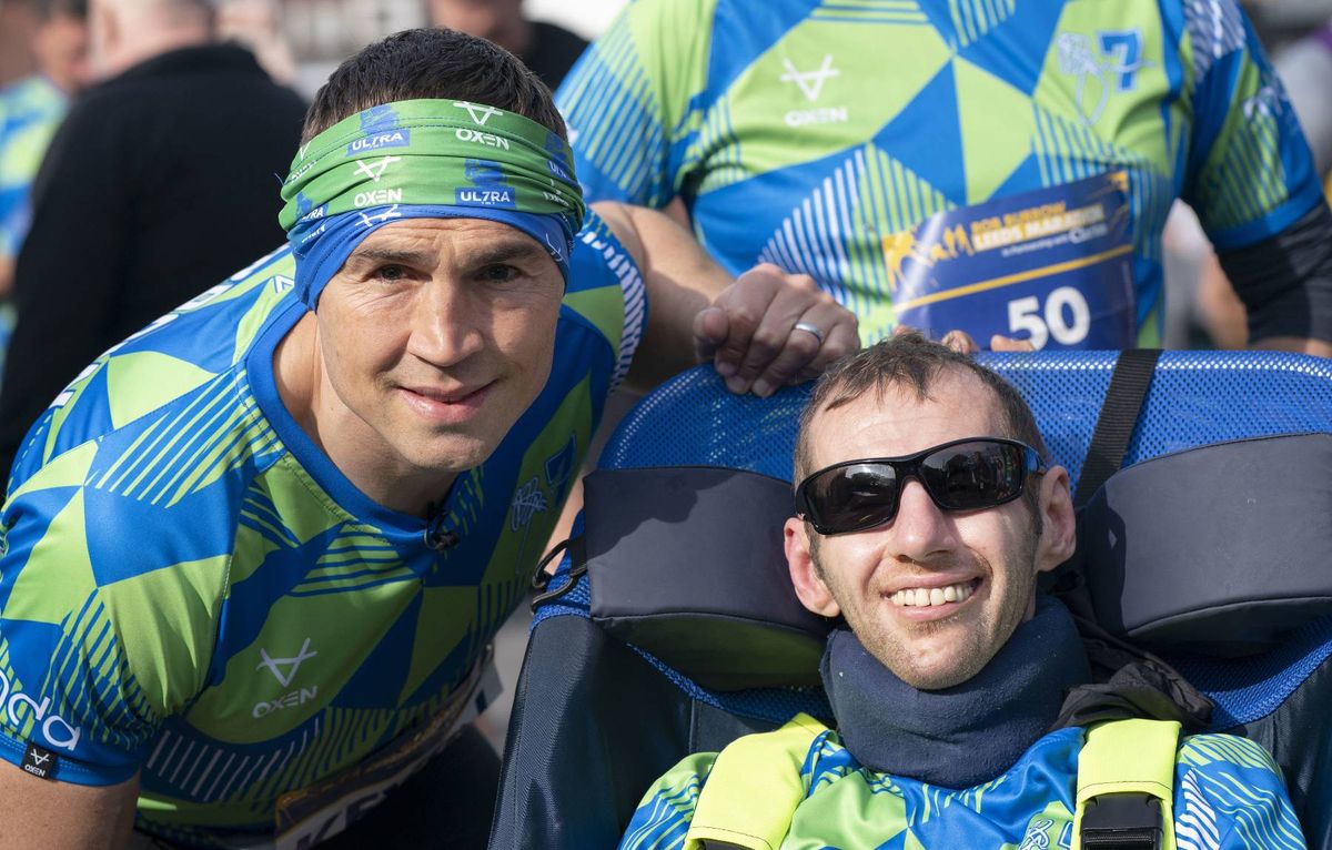 Kevin Sinfield and Rob Burrow at an event together.