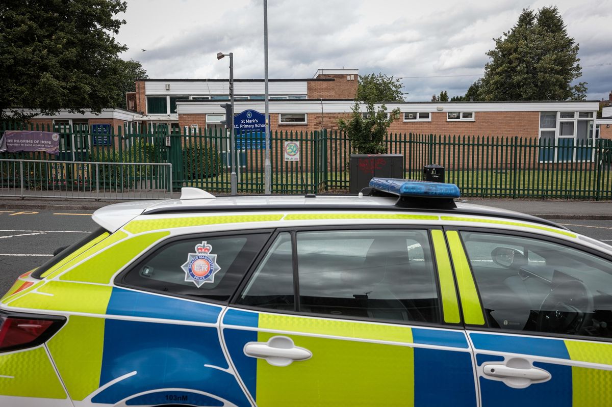 Police outside St Marks R C Primary School in Salford